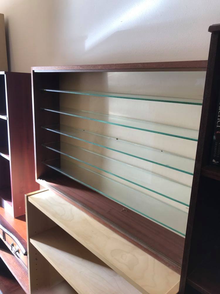Small teak display cabinet with glass shelves, ideal for model cars etc.
